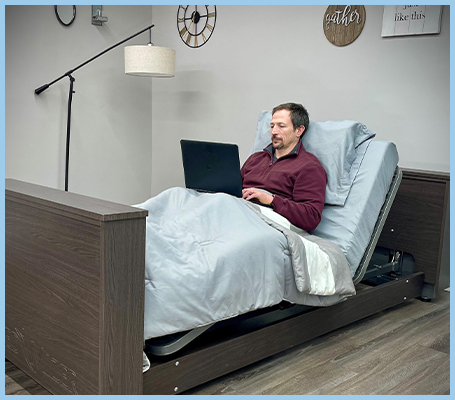 Man in bed on laptop